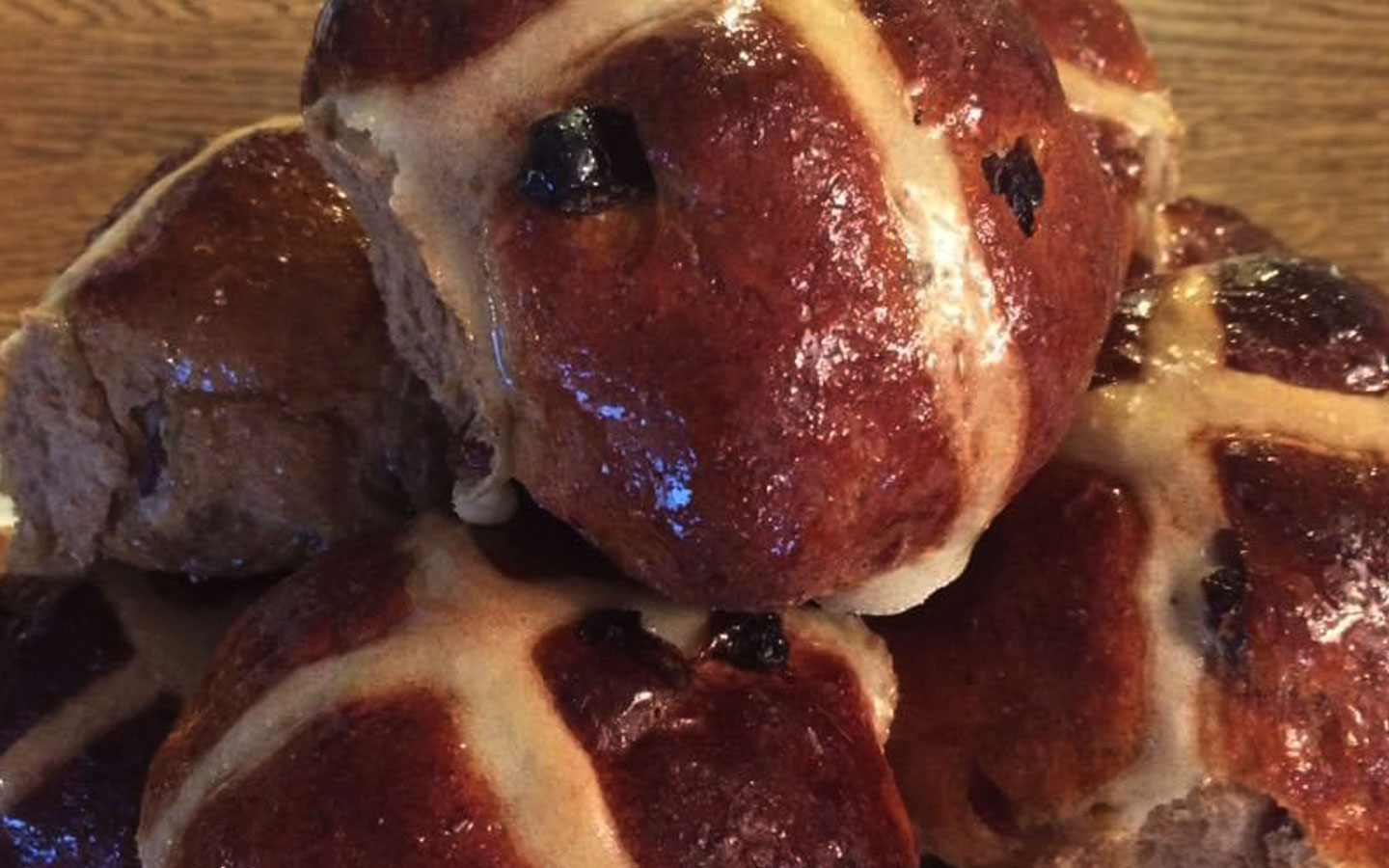 Delicious hot cross buns with glistening coating